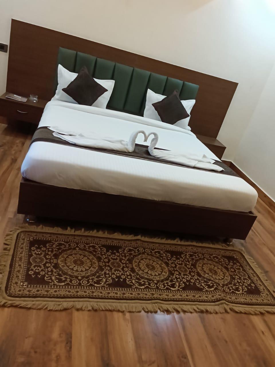 Luxury resort pool with palm trees at sunset